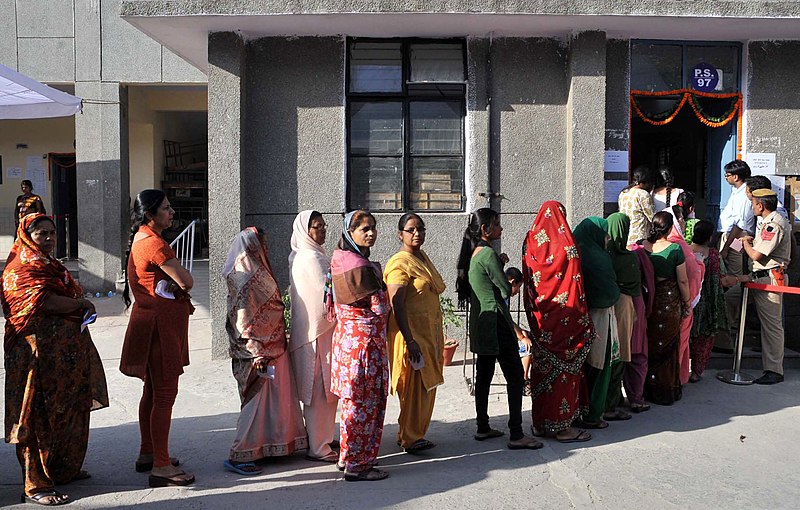 A government office with people waiting in line.